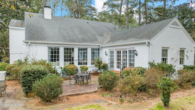 back of house with a patio area and french doors