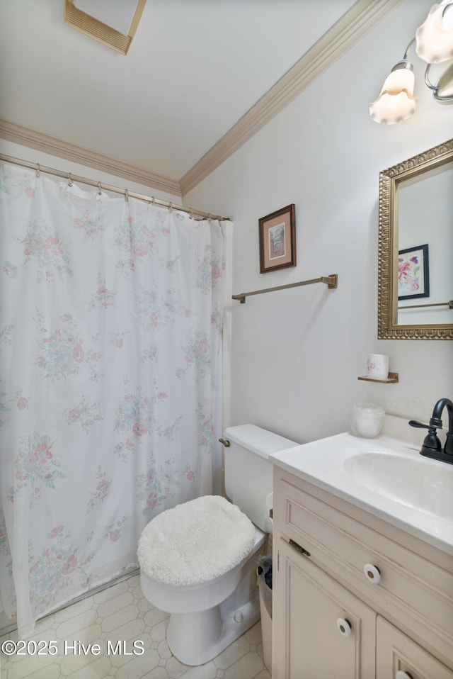 bathroom featuring ornamental molding, a shower with shower curtain, vanity, and toilet