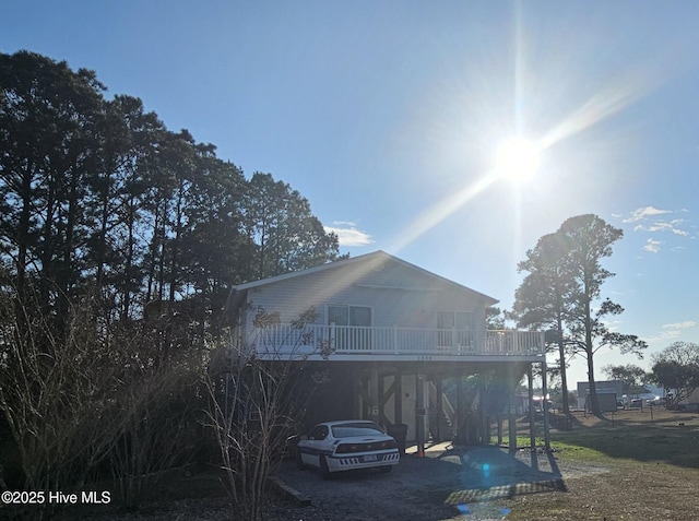 rear view of house featuring a carport