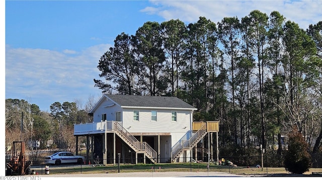 view of front of home featuring a wooden deck