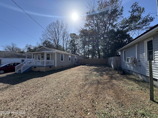 view of side of property featuring covered porch