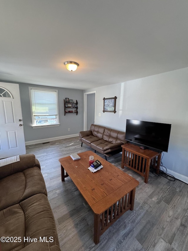 living room featuring dark hardwood / wood-style floors