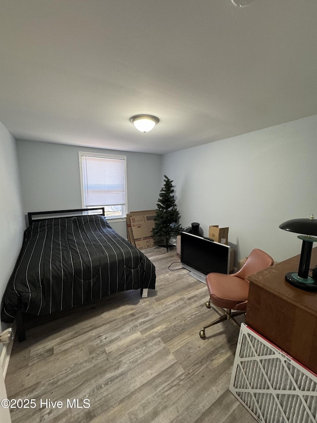 bedroom featuring hardwood / wood-style flooring