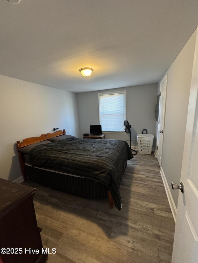 bedroom featuring dark hardwood / wood-style floors