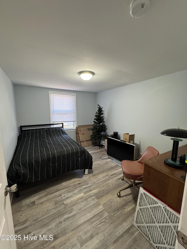 bedroom with hardwood / wood-style flooring