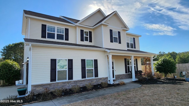 craftsman inspired home featuring covered porch