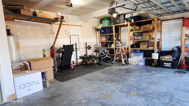 garage with water heater and a garage door opener