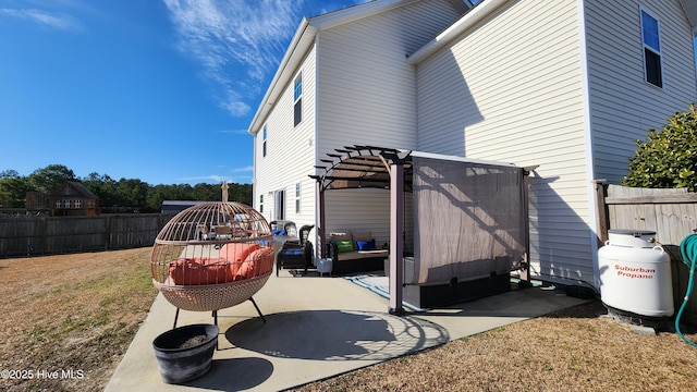 view of side of home featuring a yard and a pergola