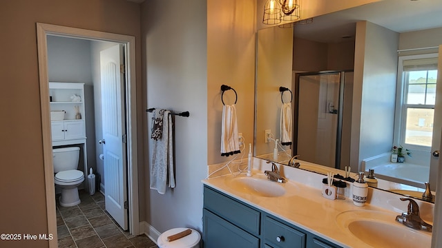 full bathroom featuring vanity, toilet, and separate shower and tub