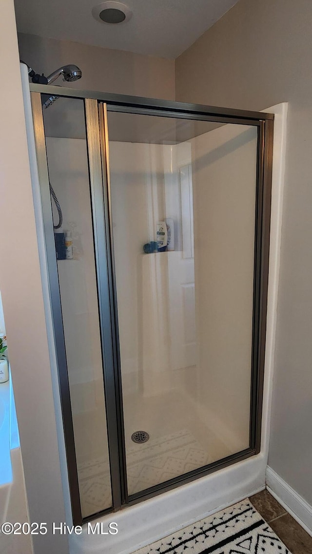 bathroom featuring an enclosed shower