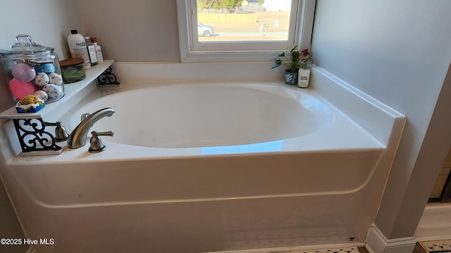 bathroom featuring a tub to relax in