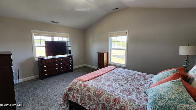 carpeted bedroom with vaulted ceiling