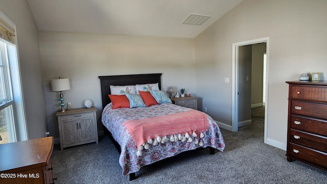 carpeted bedroom with lofted ceiling