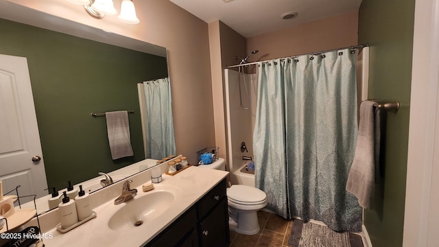 full bathroom featuring vanity, toilet, and shower / tub combo