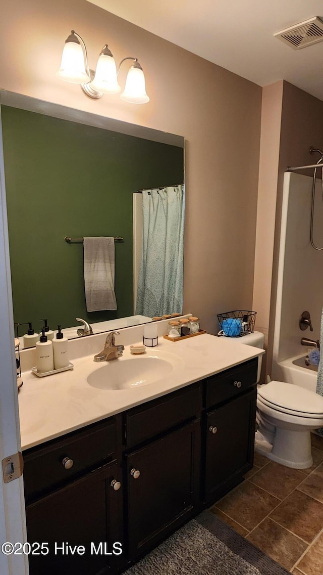 full bathroom featuring shower / tub combo, vanity, tile patterned floors, and toilet