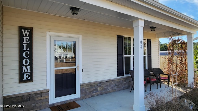 property entrance featuring covered porch