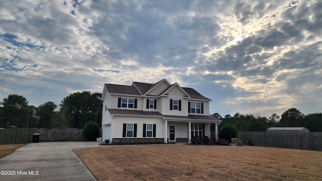 view of front of home featuring a garage and a front yard