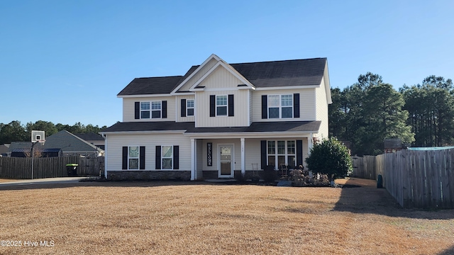 view of front of home with a porch and a front lawn