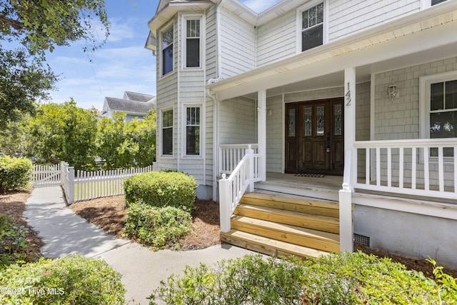 entrance to property with covered porch