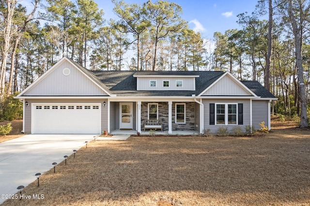 view of front facade with a garage and a porch