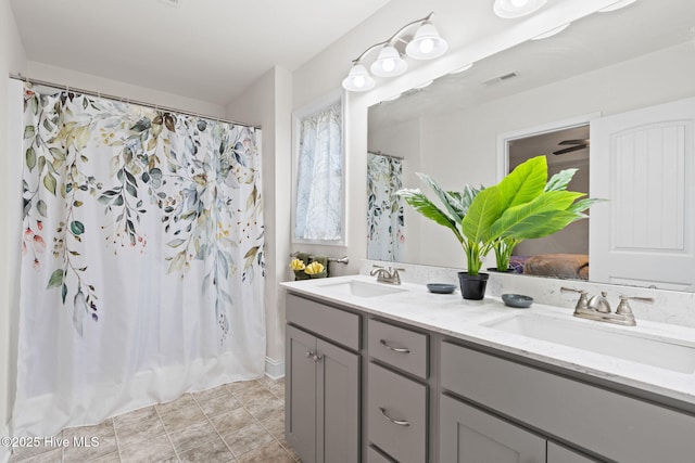 carpeted bedroom featuring baseboards and visible vents
