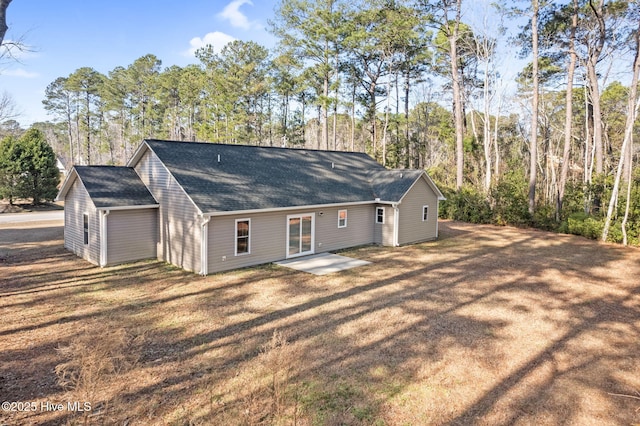 back of property with a patio area