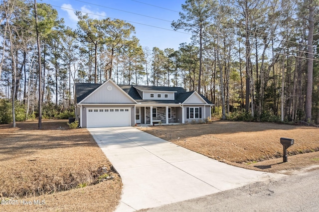 view of front facade with a garage and covered porch