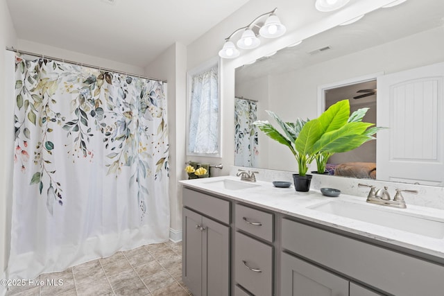 bathroom featuring vanity and walk in shower