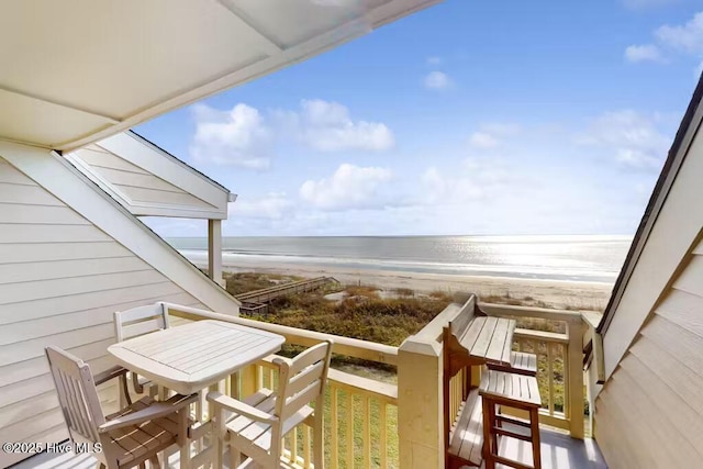 balcony with a view of the beach and a water view