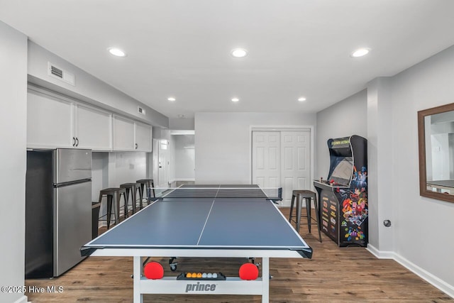 recreation room featuring light hardwood / wood-style flooring