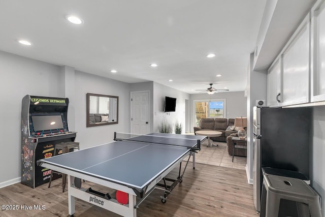 rec room featuring ceiling fan and light wood-type flooring