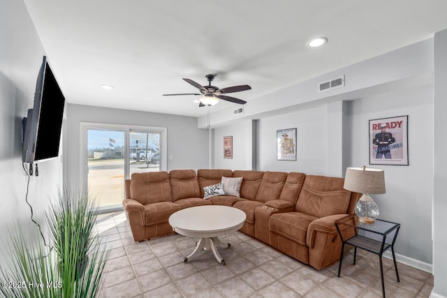 living room featuring light tile patterned flooring and ceiling fan