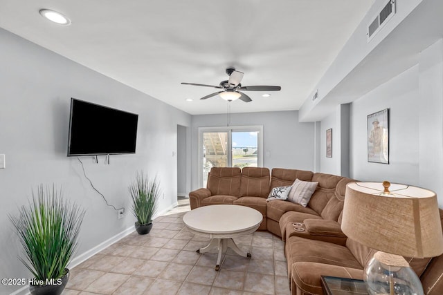 living room featuring ceiling fan and light tile patterned floors