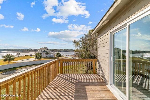 wooden terrace with a water view