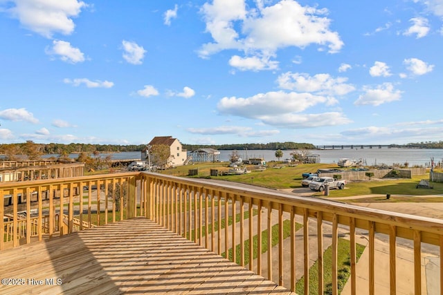 wooden deck with a water view