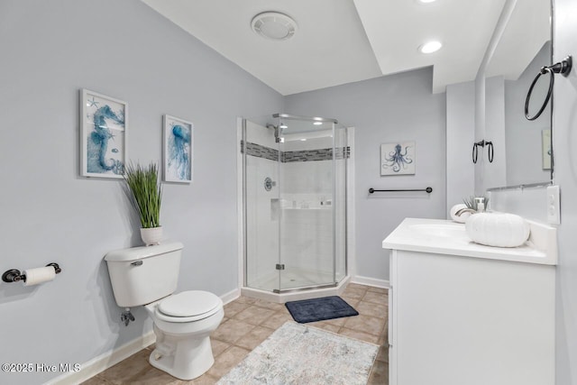 bathroom with vanity, a shower with shower door, tile patterned floors, and toilet