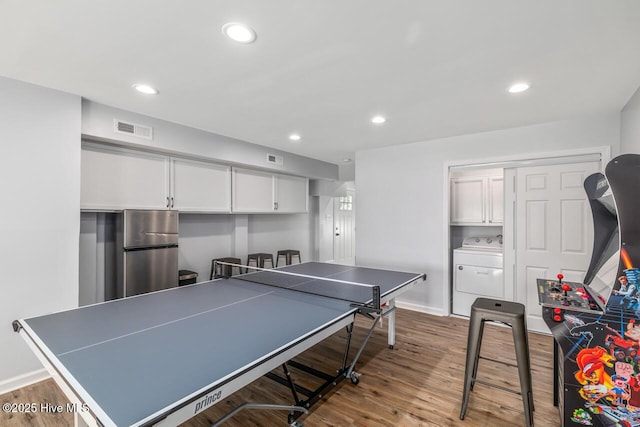 game room featuring washer / clothes dryer and hardwood / wood-style floors