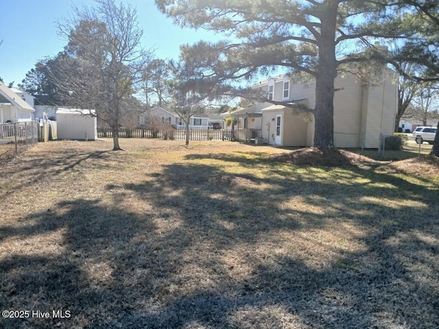 view of yard with a storage unit