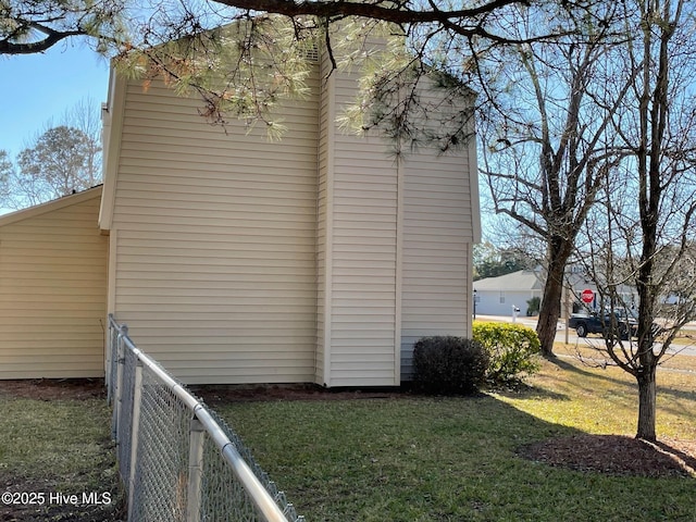 view of home's exterior with a yard