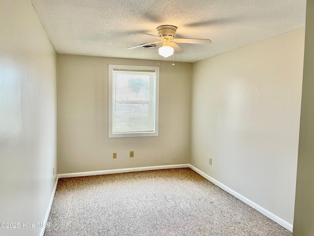 unfurnished room featuring a textured ceiling, carpet floors, and ceiling fan