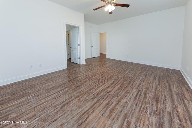 unfurnished room featuring ceiling fan and dark hardwood / wood-style flooring