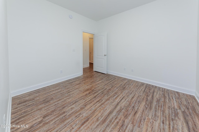 spare room with light hardwood / wood-style flooring