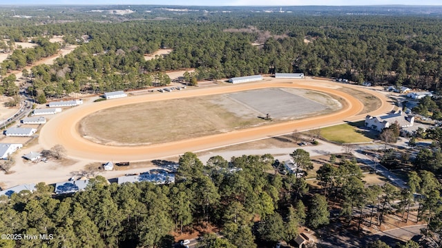 aerial view with a wooded view