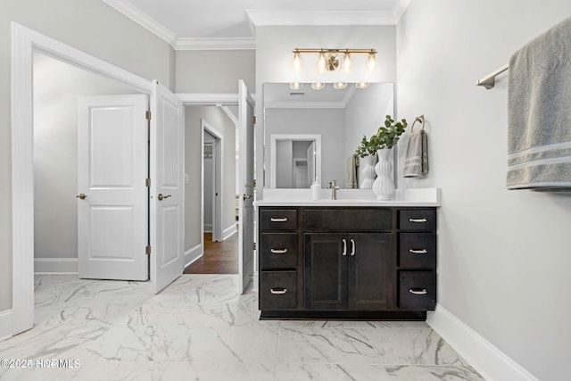 bathroom with ornamental molding and vanity