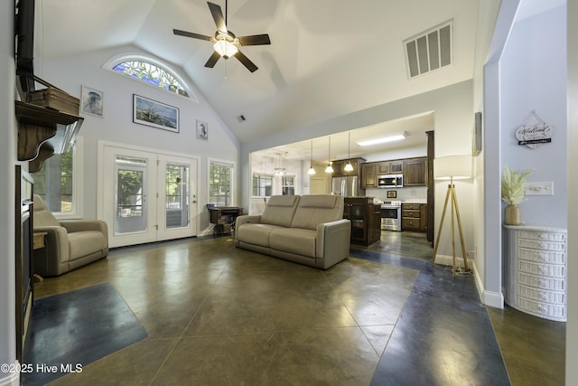 living room with ceiling fan, high vaulted ceiling, and french doors