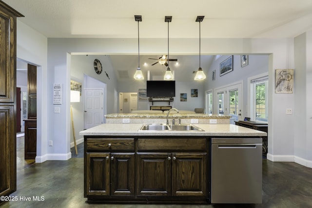 kitchen with pendant lighting, sink, a kitchen island with sink, dark brown cabinets, and stainless steel dishwasher