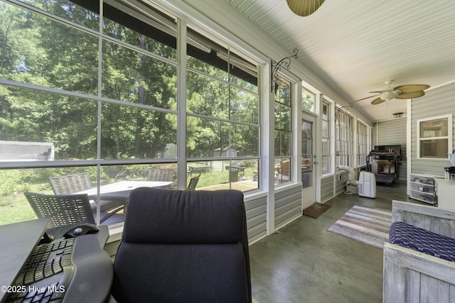 sunroom featuring plenty of natural light and ceiling fan