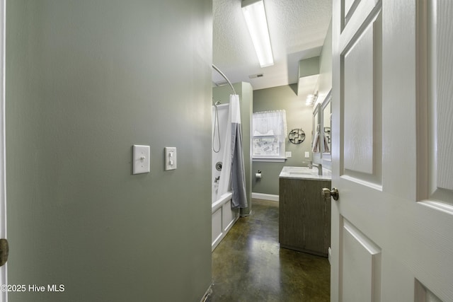 bathroom with vanity, shower / tub combo, concrete floors, and a textured ceiling