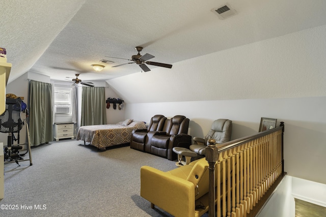 carpeted bedroom featuring lofted ceiling, ceiling fan, and a textured ceiling