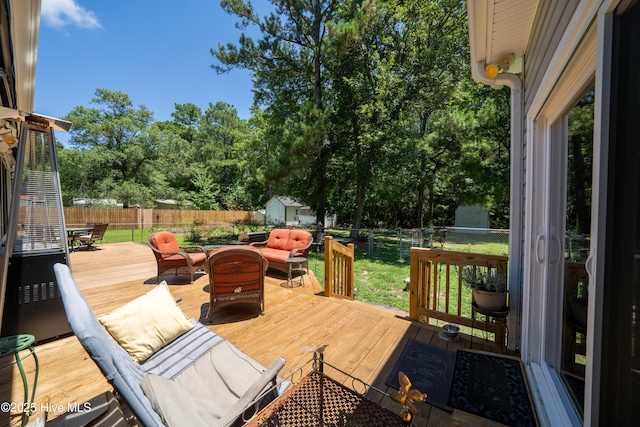 wooden terrace featuring outdoor lounge area